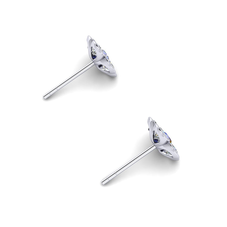 Floral diamond and blue sapphire platinum studs perspective