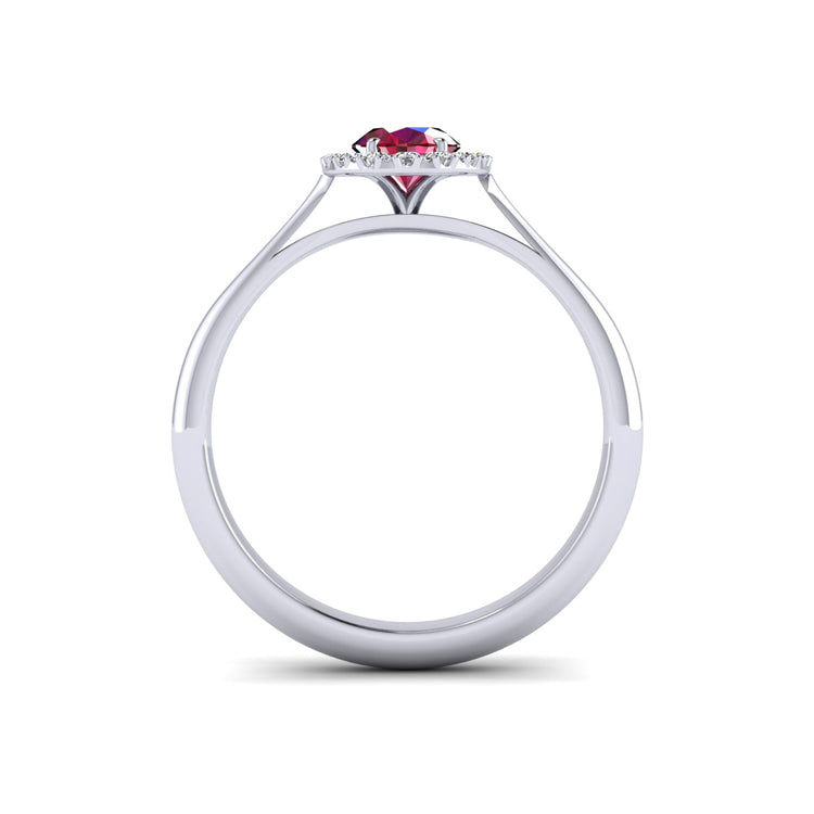 Hand Fabricated Ruby and Diamond Halo Platinum Ring Through Finger View