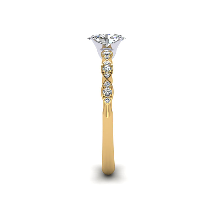Oval diamond in platinum setting. Marquise shaped 18ct yellow gold shank with round diamonds. Side view